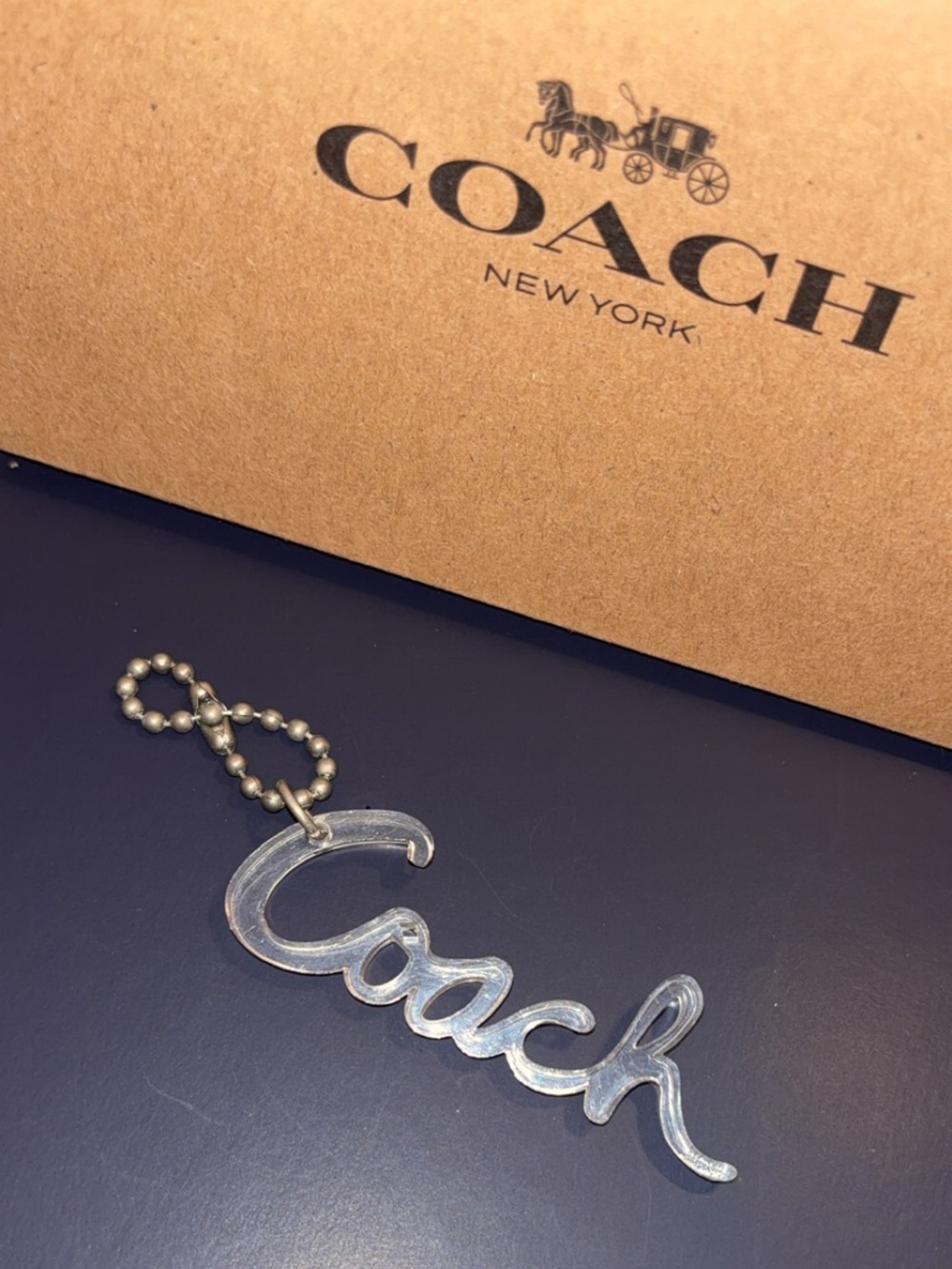 Coach Poppy Clear Script hangtag